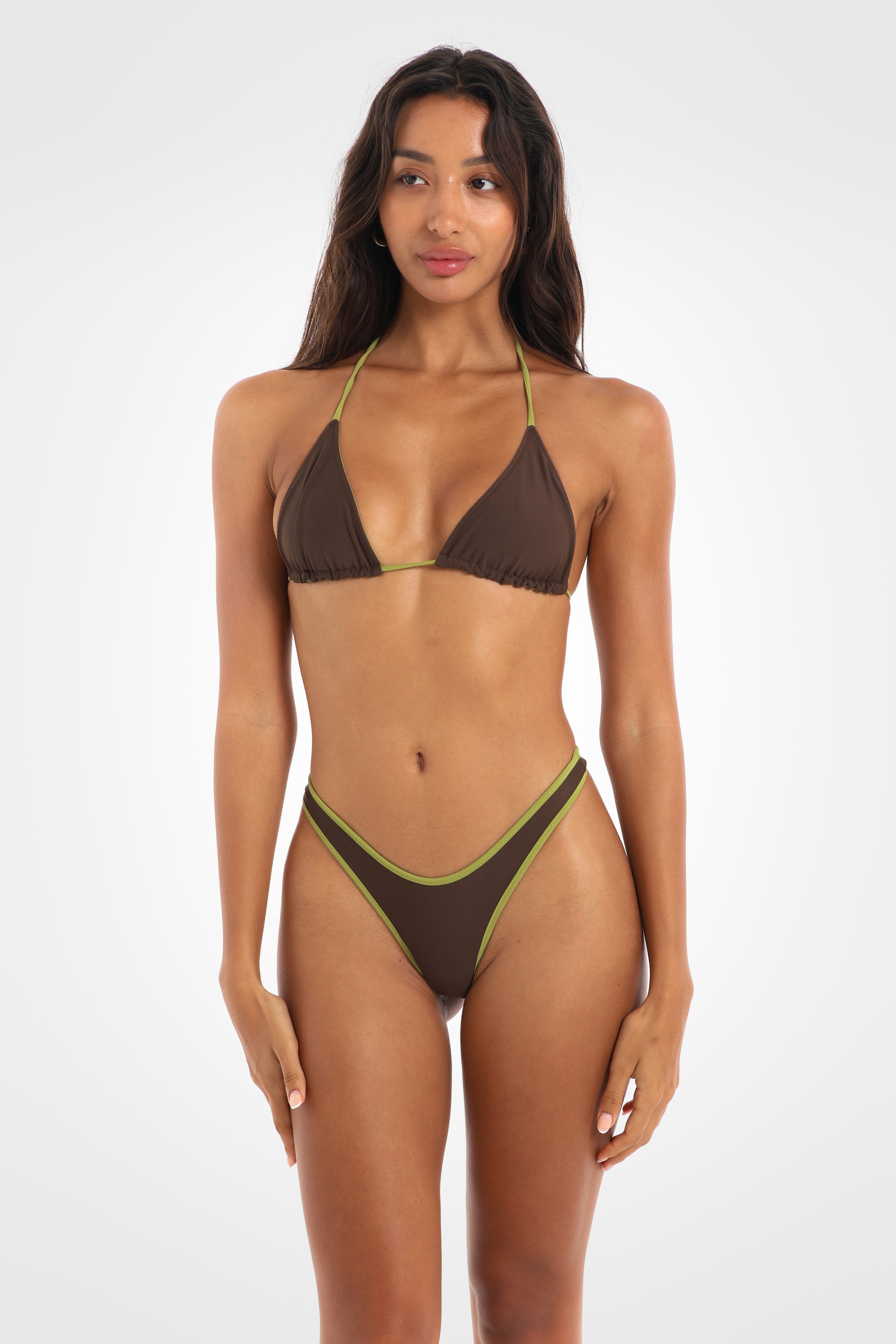 Front view of the Aruna Reversible Classic Low Coverage Bikini Bottoms in chocolate brown featuring a high-cut silhouette, fixed sides, and a sculpted low-coverage fit with pistachio-green edging.