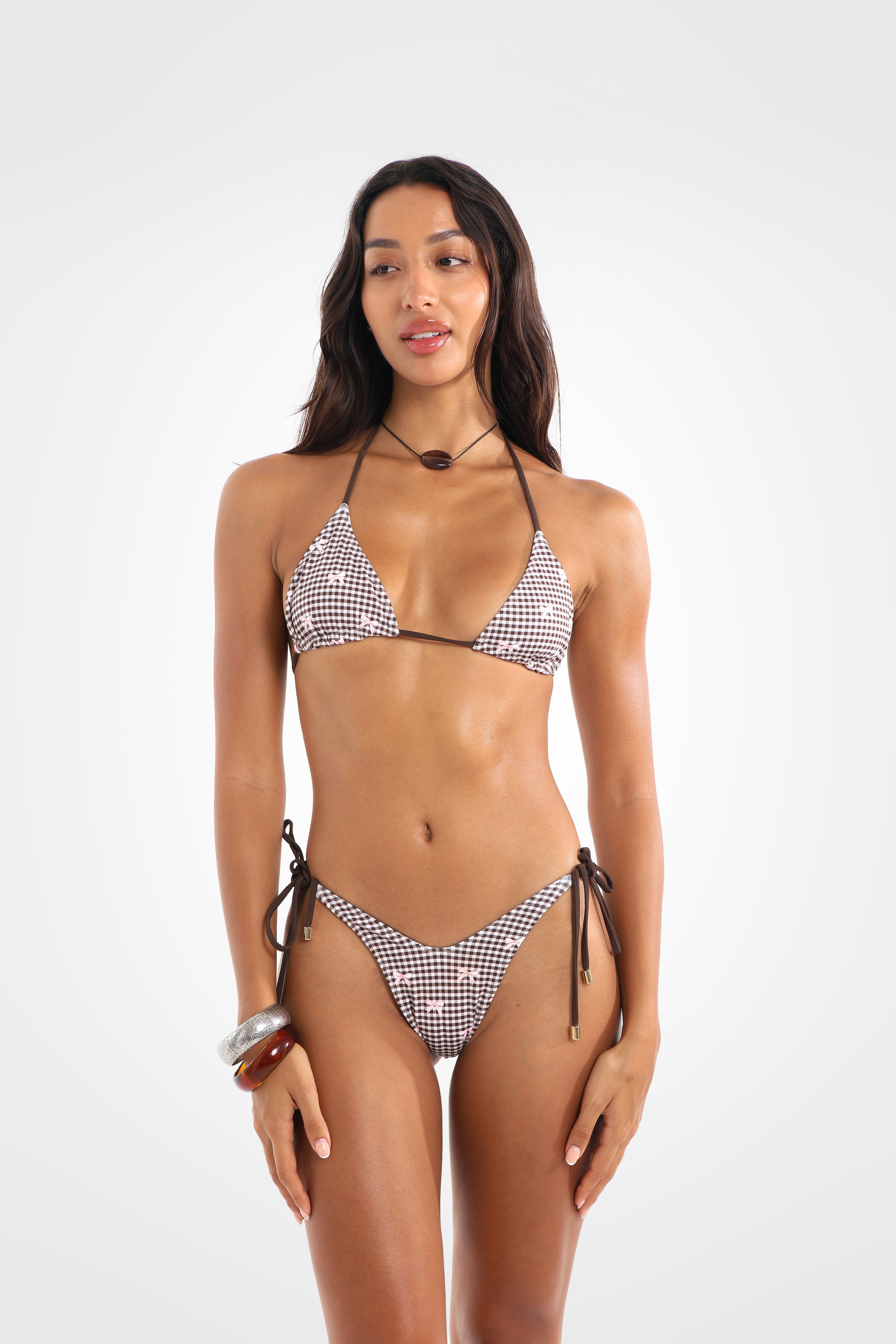 Front view of the Bocini Reversible Side Tie High Coverage Bikini Bottoms in the exclusive brown gingham print with pink bow details, featuring adjustable side ties and a high-cut silhouette.