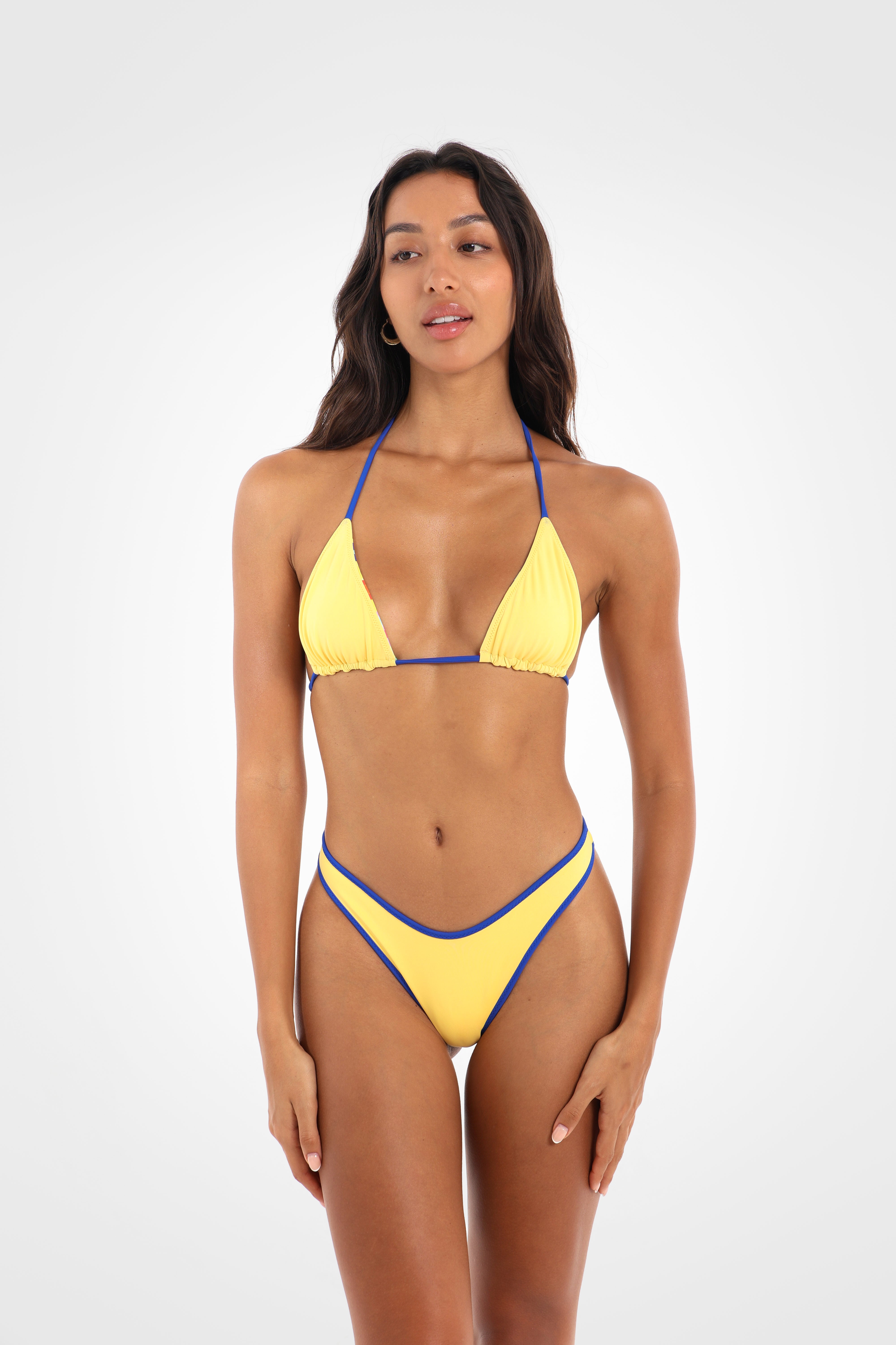 Front view of the Fiolita Reversible Classic High Coverage Bikini Bottoms in vibrant yellow featuring a high-cut silhouette, fixed sides, and a flattering high coverage fit.