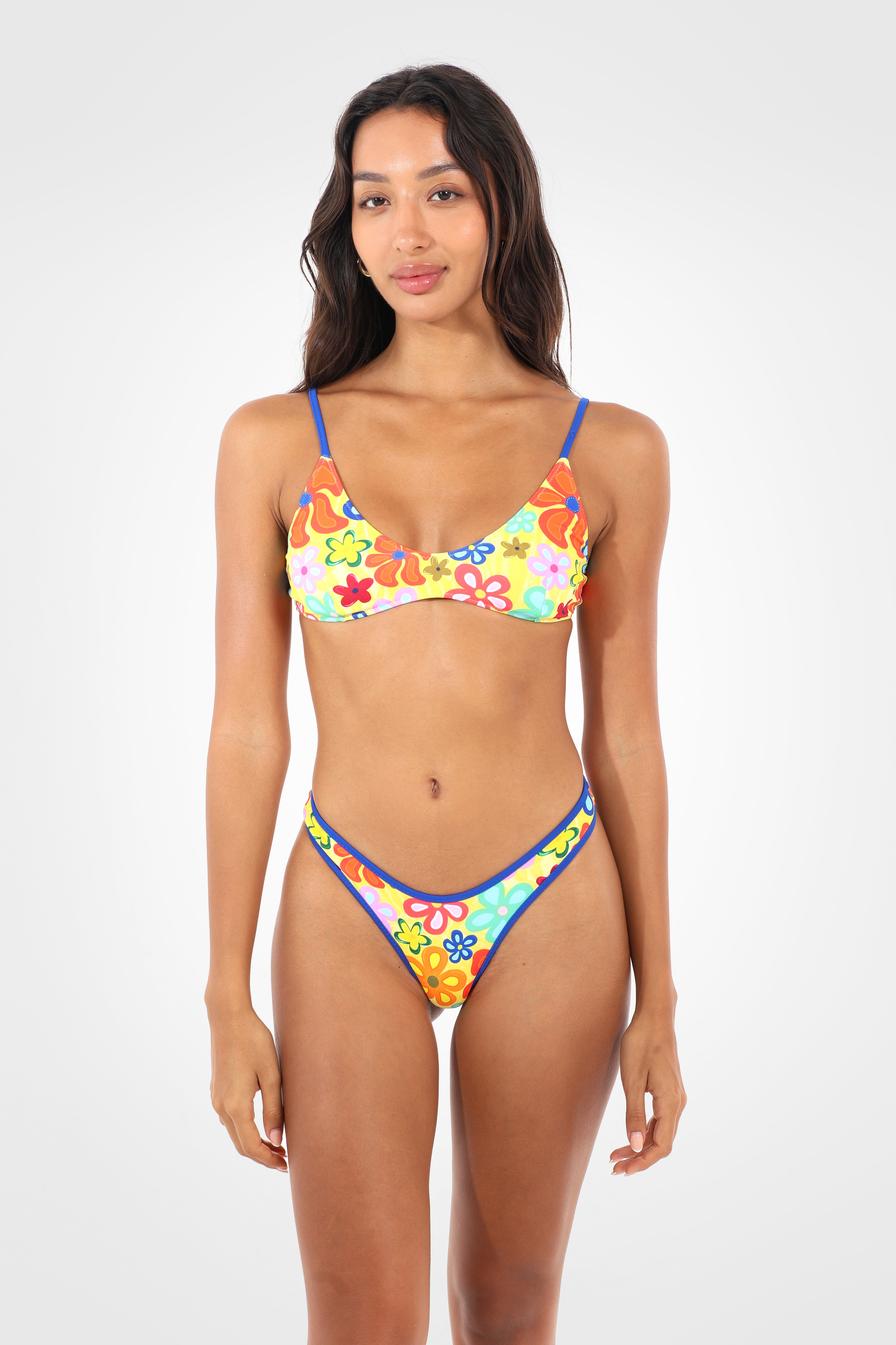 Front view of the Fiolita Reversible Classic Low Coverage Bikini Bottoms in the exclusive Fiolita wildflower print featuring a high-cut silhouette, fixed sides, and a sculpted cheeky fit.
