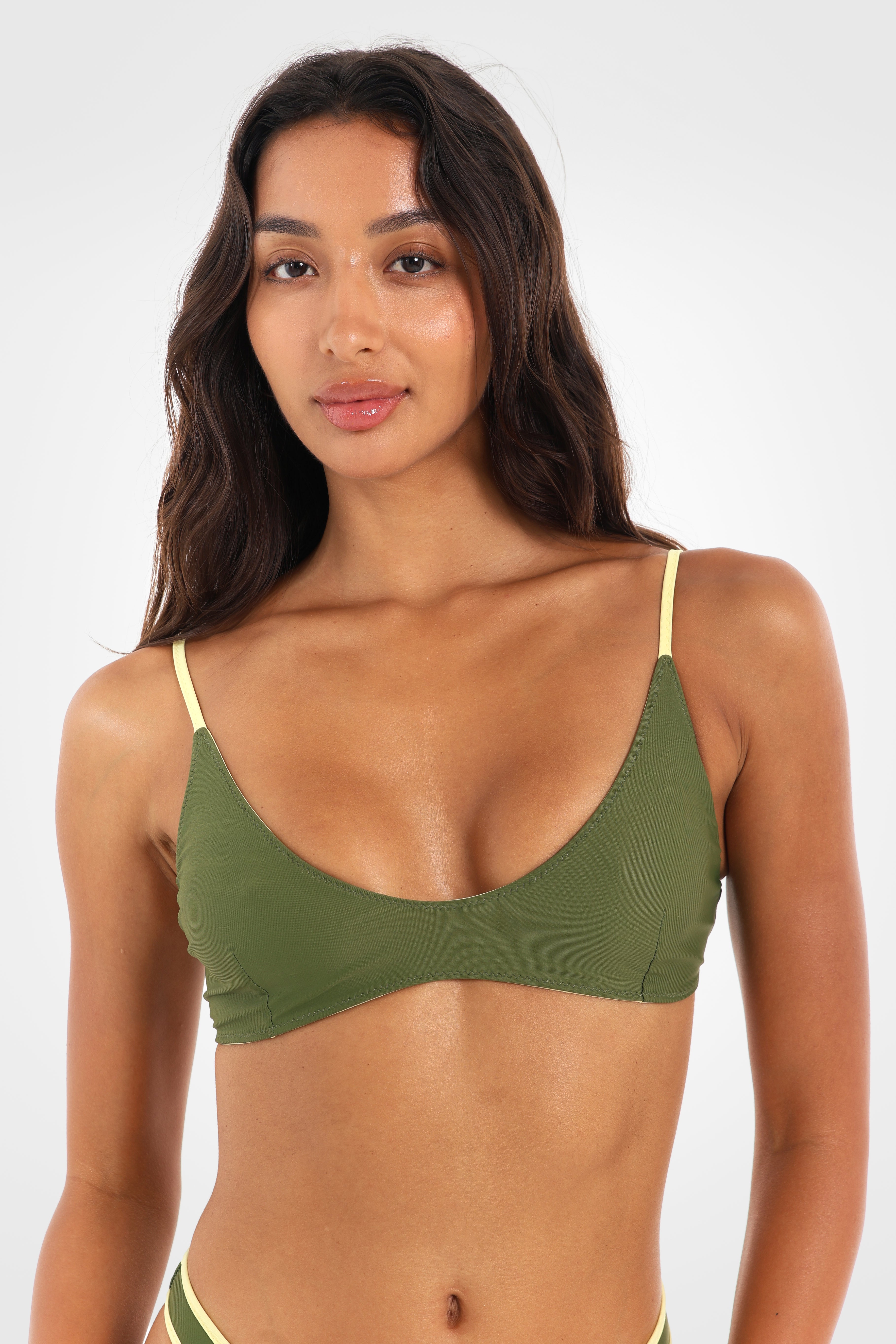 Close-up front view of the Mossii Reversible Scoop Bikini Top highlighting the flattering scoop neckline, clean silhouette, and khaki green finish.