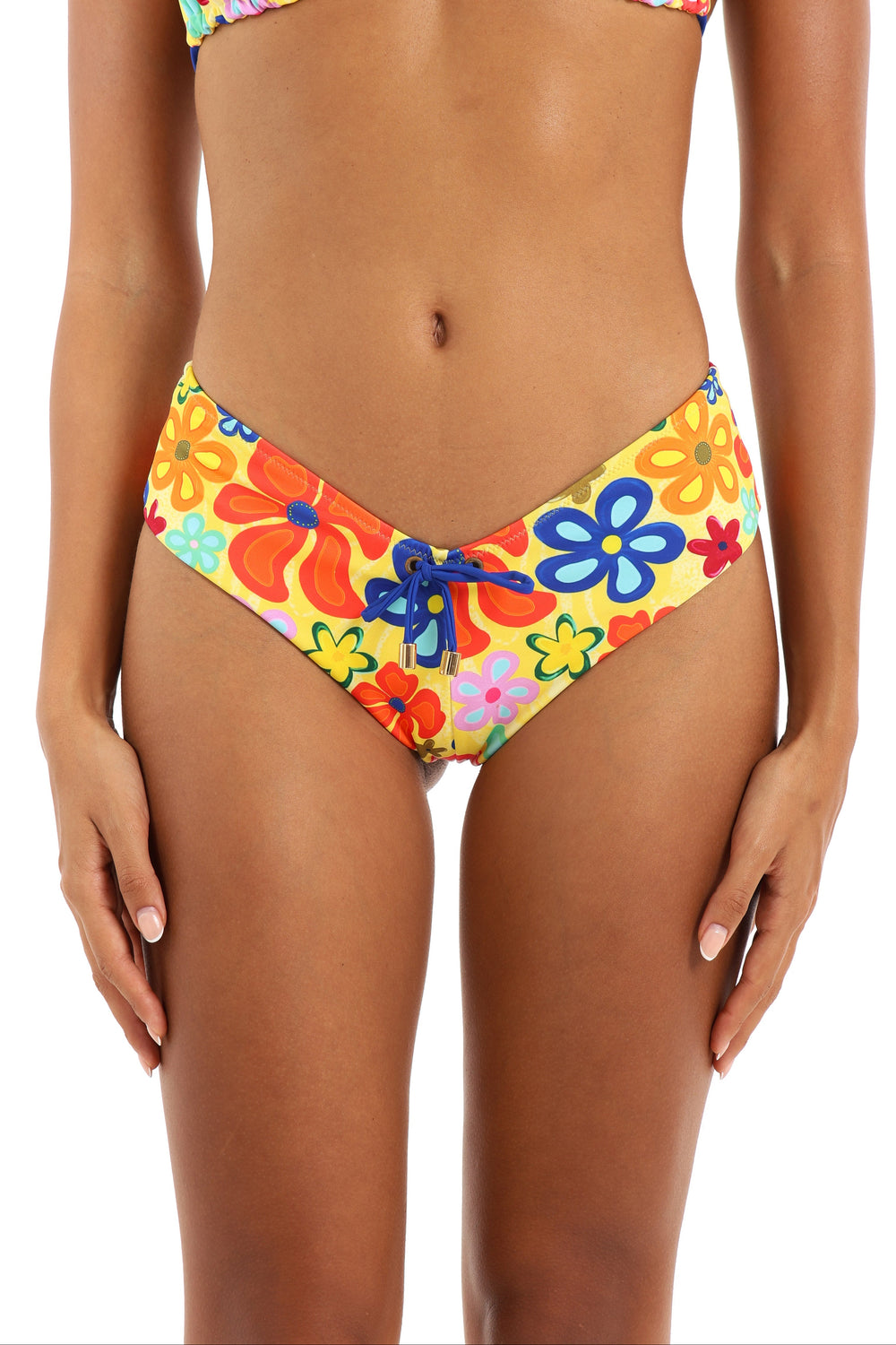 Model wearing Fiolita cheeky shortie bikini bottoms in wildflower print by Rays of Earth