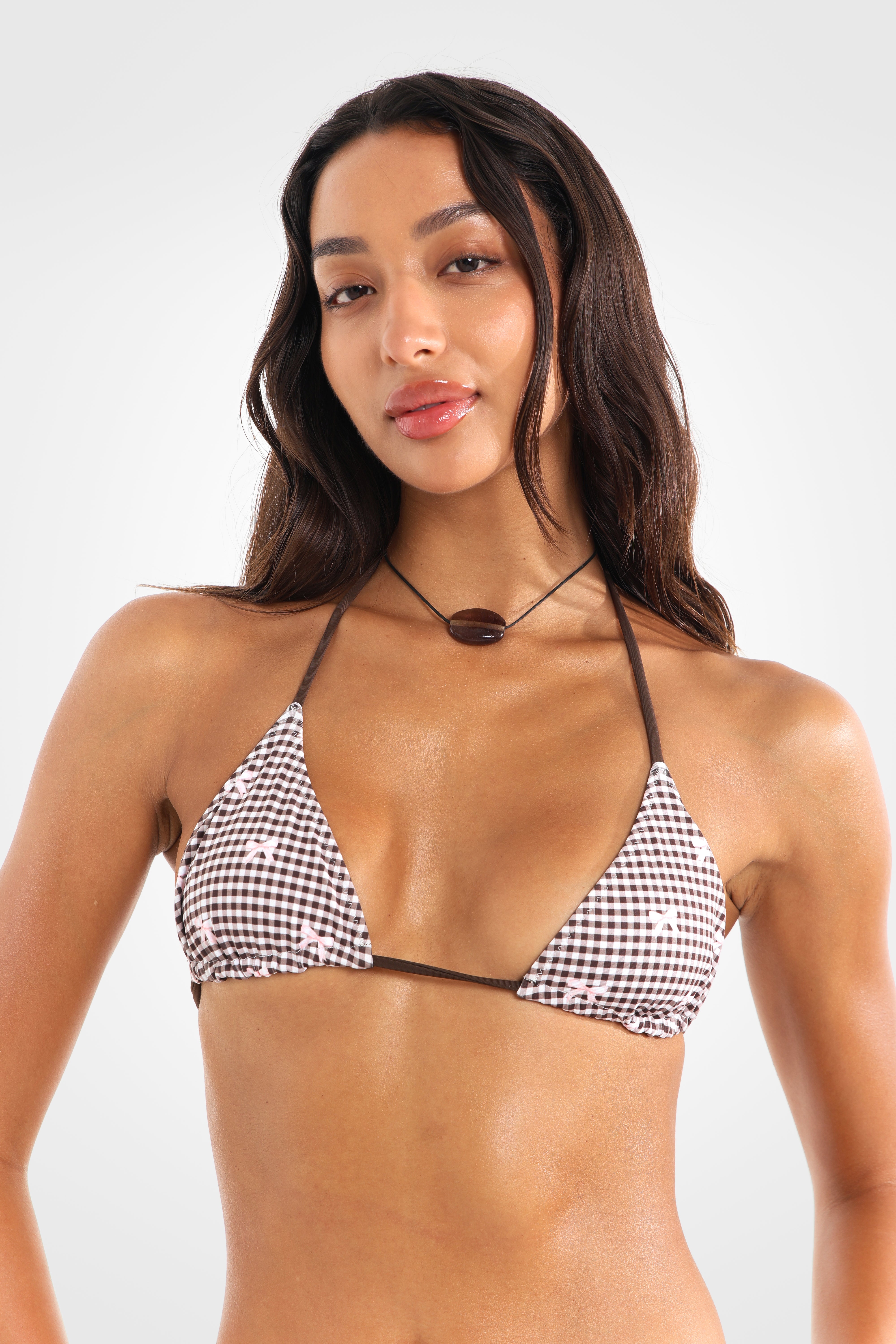 Close-up front view of the Bocini Reversible Triangle Bikini Top highlighting the exclusive Bocini brown gingham print, adjustable sliding triangle cups, and mocha brown contrast ties.